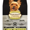 Bolsa con imagen de perrito tierno mirando la camara, con alimento Oven Baked Tradition Adult Small Breed Chicken Adulto pequeño